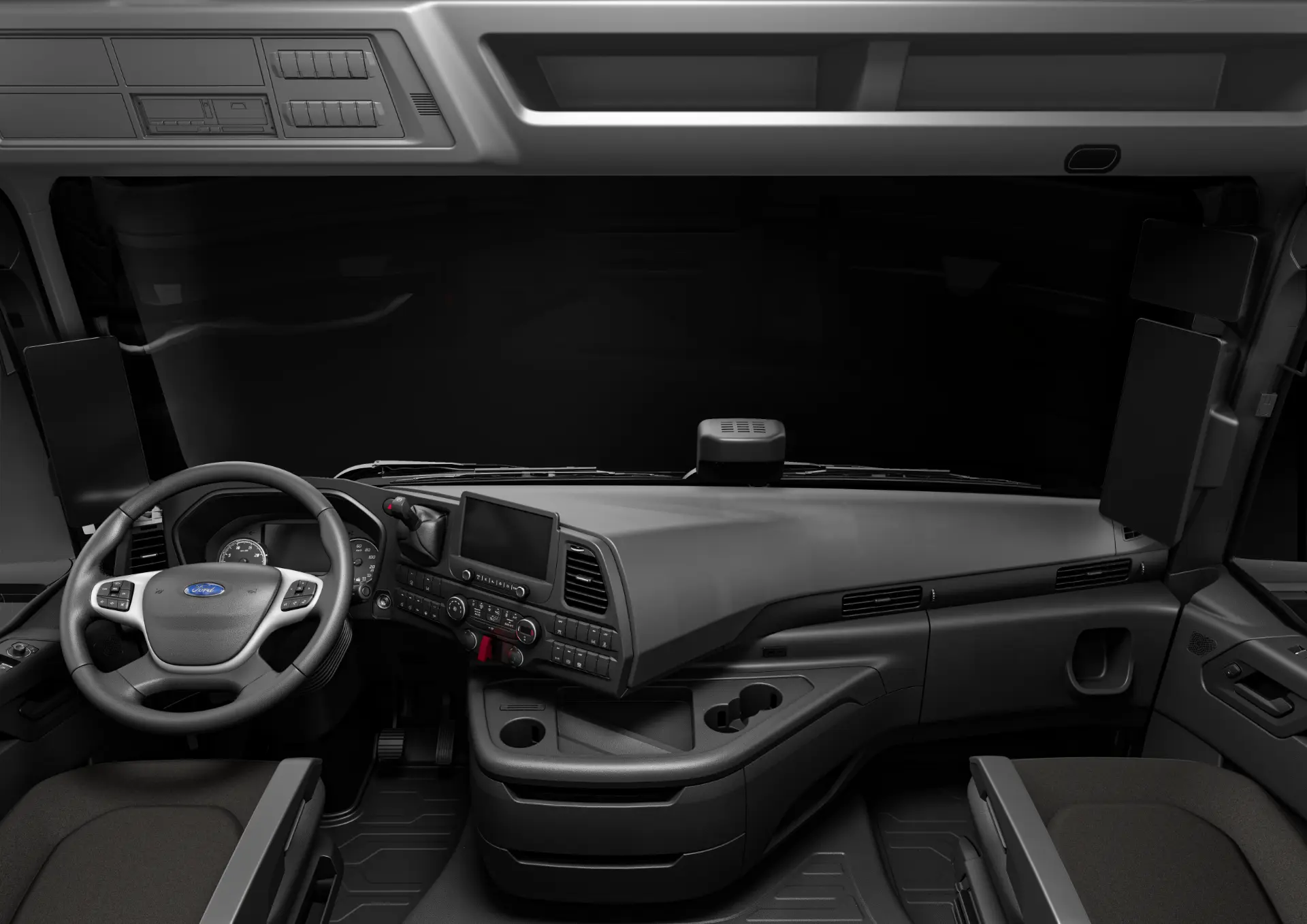 Vista interior de una moderna cabina de Ford Trucks GEN2 en España, mostrando el salpicadero, el volante y los mandos del conductor diseñados para eficiencia y bajo consumo de combustible.