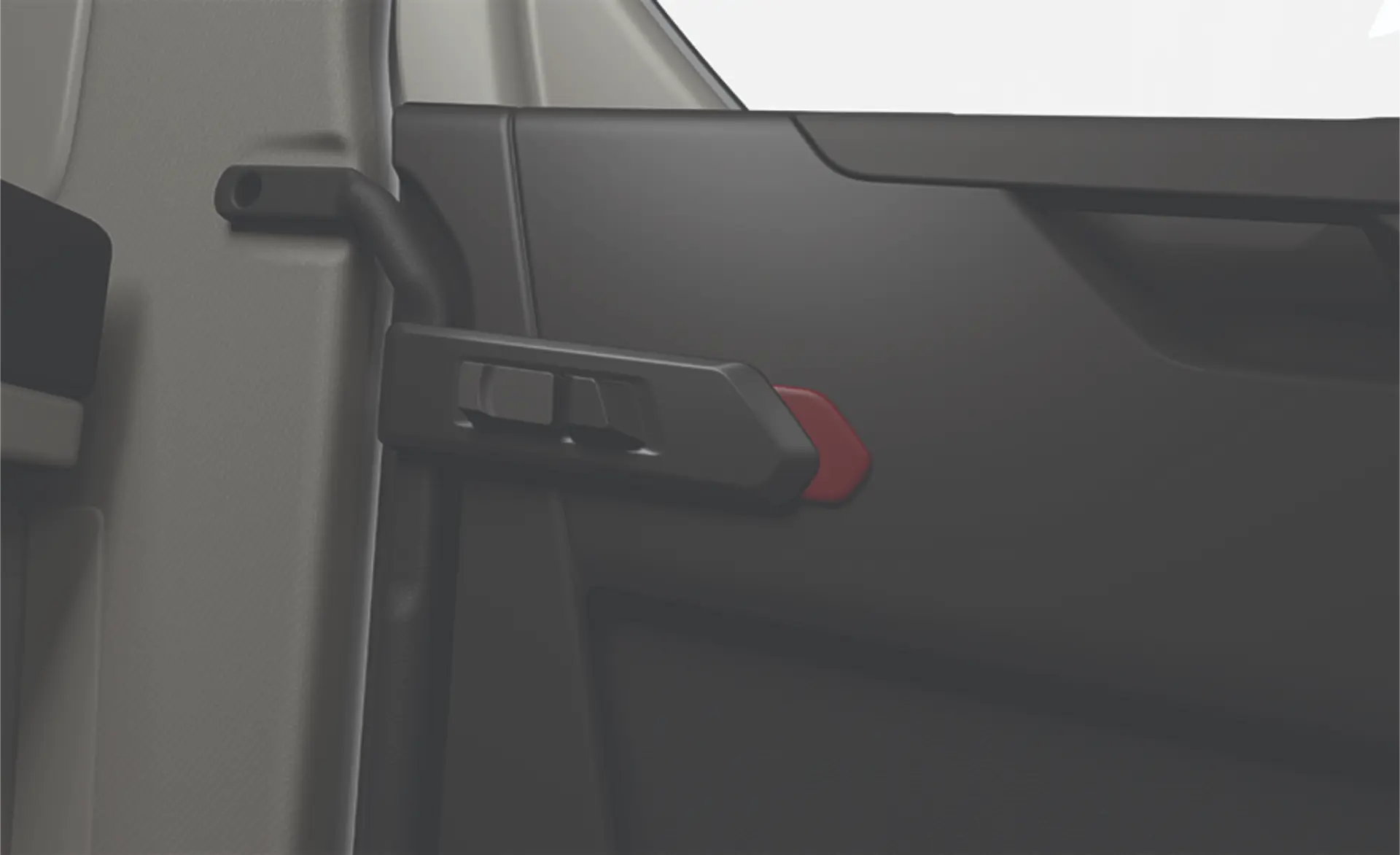 Primer plano de la manilla interior de una puerta de coche con un acento rojo sobre un panel negro.